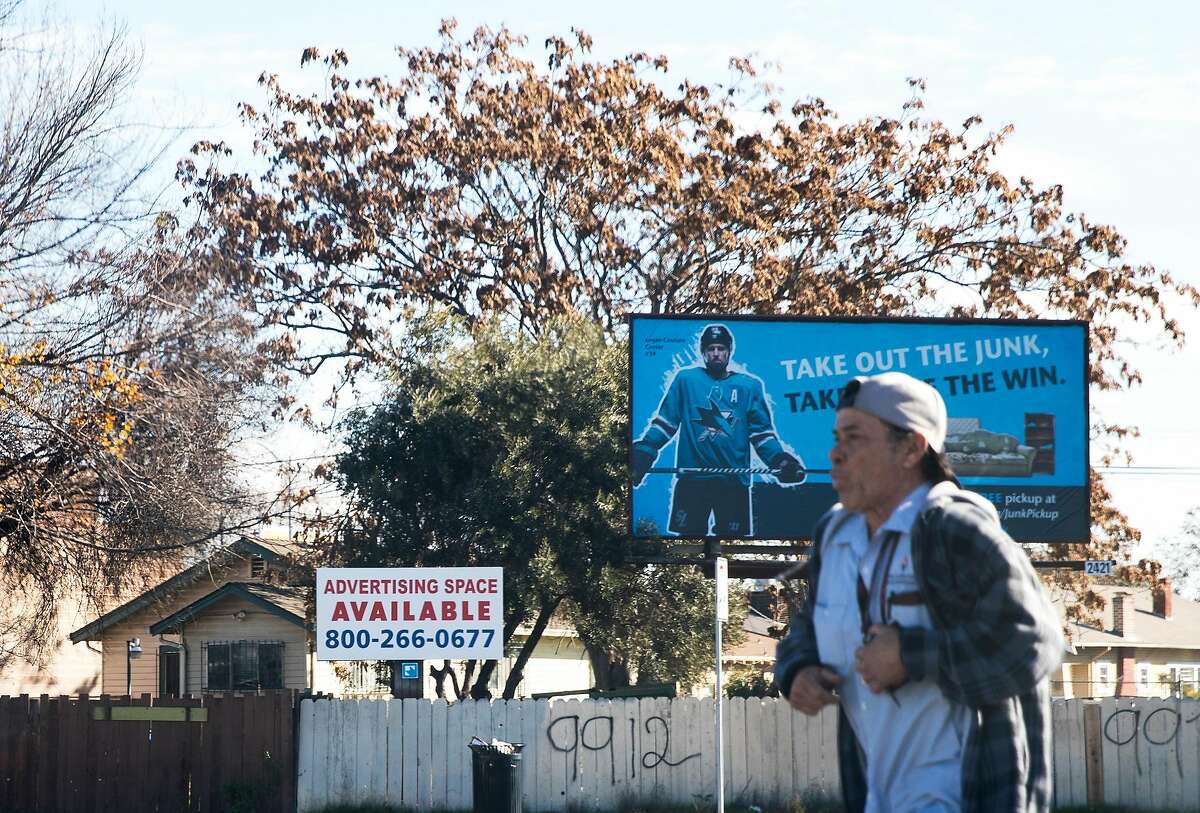 A dilapidated fence and advertisement signage is seen at the corner of West San Carlos Street and South Montgomery Street near the San Jose Diridon Train Station in San Jose, Calif. Friday, Jan. 4, 2019.