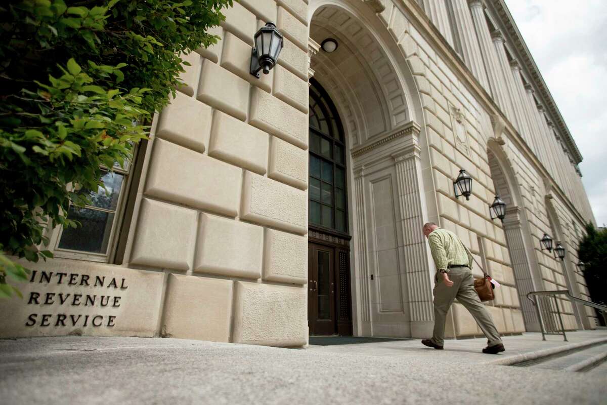 FILE- In this Aug. 19, 2015, file photo the Internal Revenue Service Building in Washington. The prolonged government shutdown couldn’t come at a worse time for the Internal Revenue Service. The tax filing season is opening soon. And for taxpayers, payments for those who owe Uncle Sam likely will still be due April 15, but people due refunds could see a delay if the partial shutdown persists.
