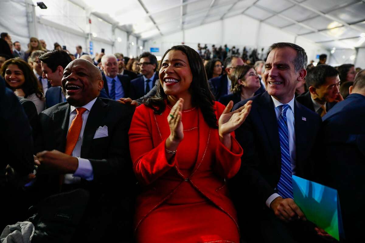 Former San Francisco Mayor Willie Brown, San Francisco Mayor London Breed and Los Angeles Mayor Eric Garcetti (right) laugh ahead of Governor Gavin Newsom inauguration ceremony in Sacramento, California, on Monday, January 7th, 2019.