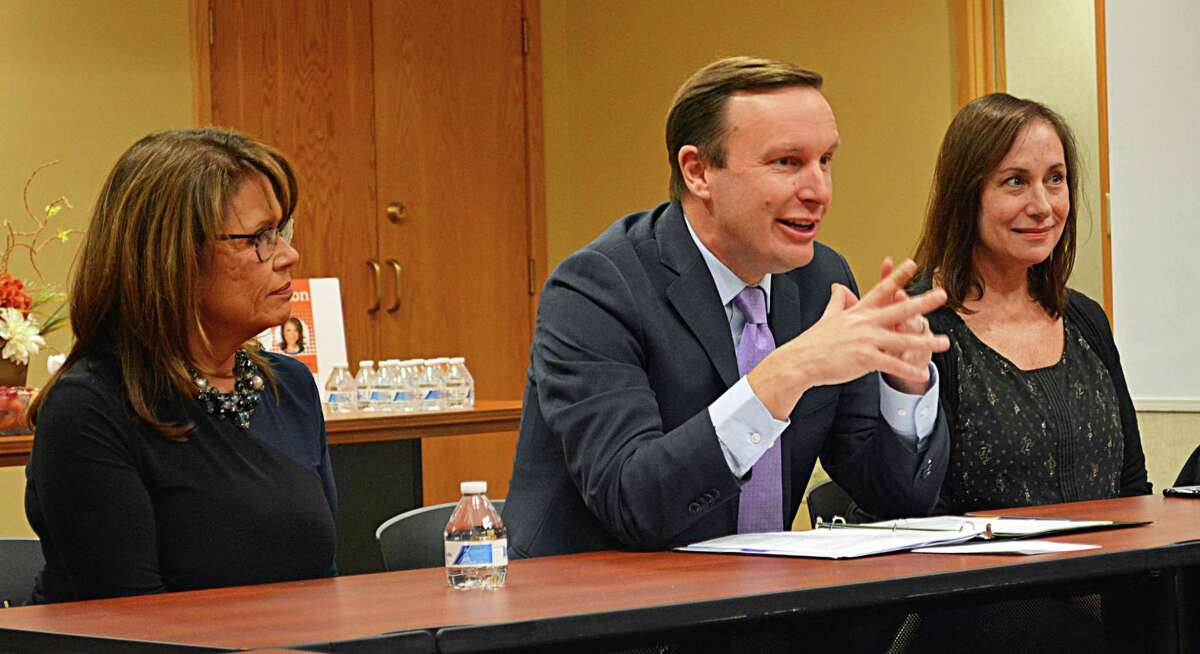 U.S. Sen. Chris Murphy, center, met with a large number of individuals who work with homeless teens at The Connection in Middletown Monday. Last month, Connecticut received $6.5 million from the U.S. Department of Housing and Urban Development to fund a new Youth Homelessness Demonstration Program. At left is Lisa DeMatteis-Lepore, CEO of The Connection, and at right, Mary Ann “Mimi” Haley, deputy director of the Connecticut Coalition to End Homelessness.