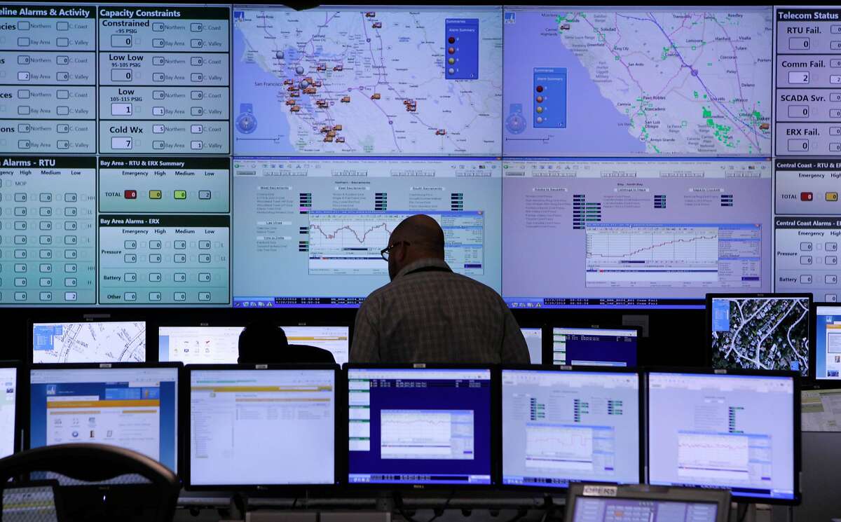 A PG&E technician monitors real-time information at the utility's gas control center in San Ramon, Calif. on Friday, Dec. 6, 2013. The new state-of-art facility, which features a 90-foot long video screen, will be staffed around the clock to monitor the distribution of natural gas over the utility's 70,000-square-mile service area.