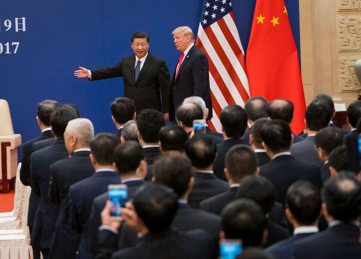 FILE -- President Donald Trump and President Xi Jinping of China in Beijing, Nov. 9, 2017. Trump is cheerleading his way past the economic warning signs that have rattled financial markets and unnerved economists, insisting that the United States has an advantage in a crucial first round of trade negotiations beginning on Jan. 7, 2019, in Beijing. (Doug Mills/The New York Times)