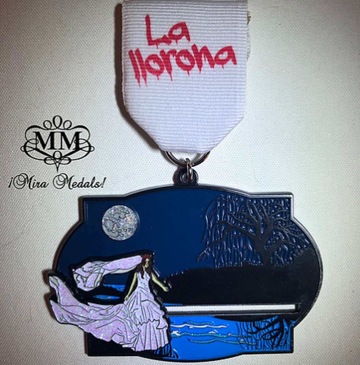 Mira Medals, owned by husband-wife duo Albert and Natasha Gonzales, designed the La Llorona pin for Fiesta 2019 that's packed with fun features.