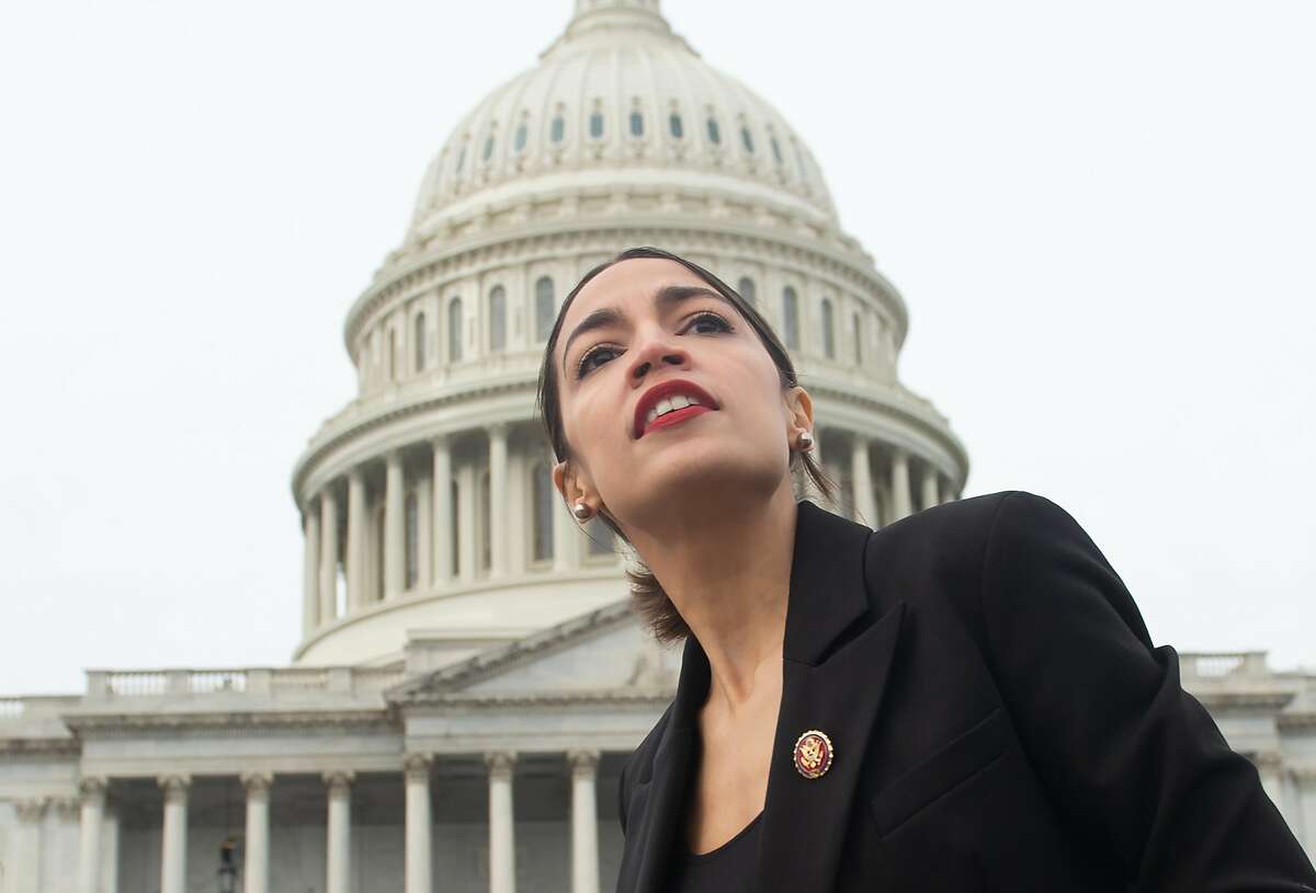 TOPSHOT - US Representative Alexandria Ocasio-Cortez, Democrat of New York, leaves a photo opportunity with the female Democratic members of the 116th US House of Representatives outside the US Capitol in Washington, DC, January 4, 2019. (Photo by SAUL LOEB / AFP)SAUL LOEB/AFP/Getty Images