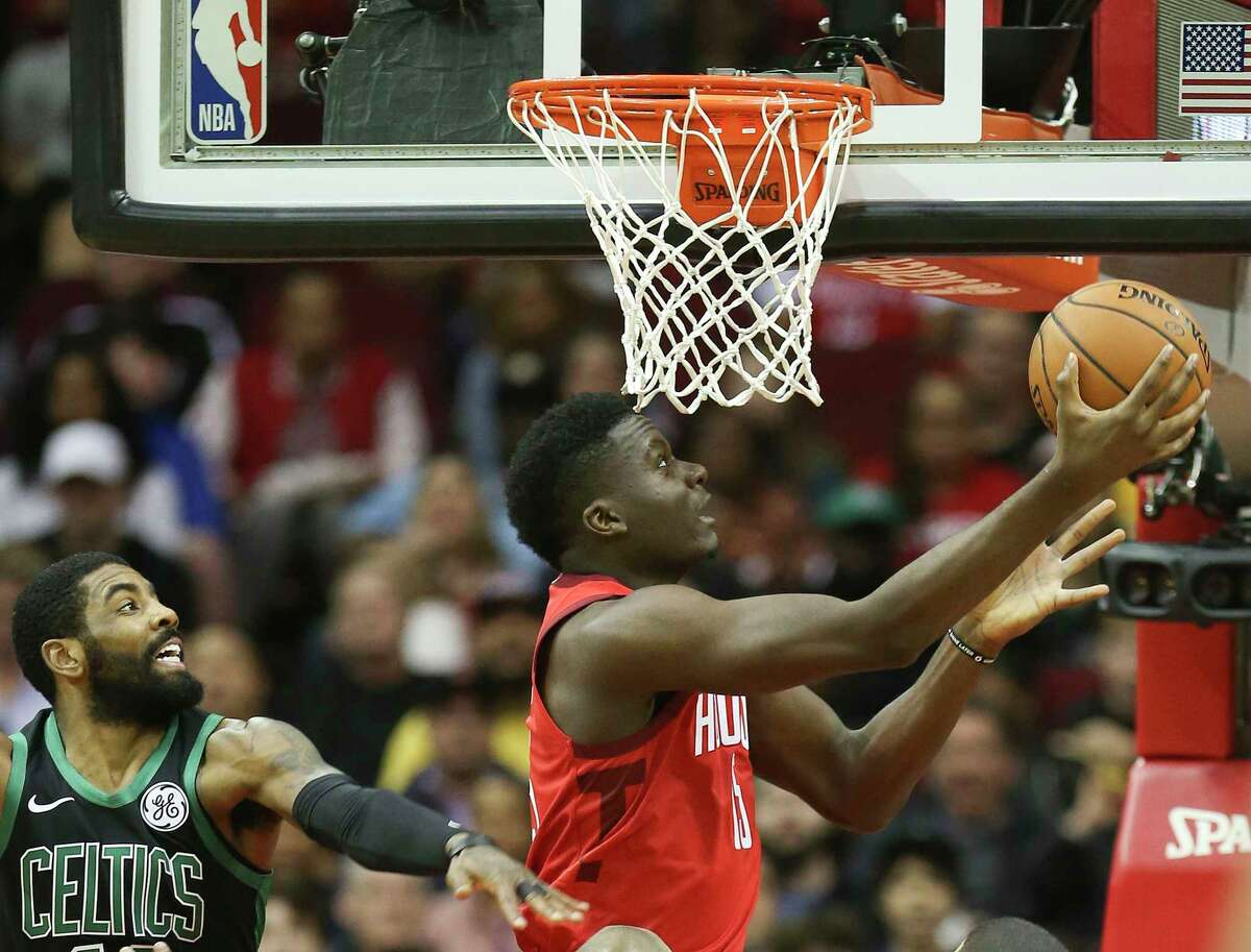 PHOTOS: Former Texas high school stars in the NBA  Houston Rockets center Clint Capela (15) goes up for a reverse layup against Boston Celtics guard Kyrie Irving (11) in the first half of NBA game action at the Toyota Center on Thursday, Dec. 27, 2018 in Houston. Capela had 38 points in the Rockets' 127-113 win.  >>>Here's a look at players on 2018-19 NBA rosters who played high school basketball in the state of Texas ... 