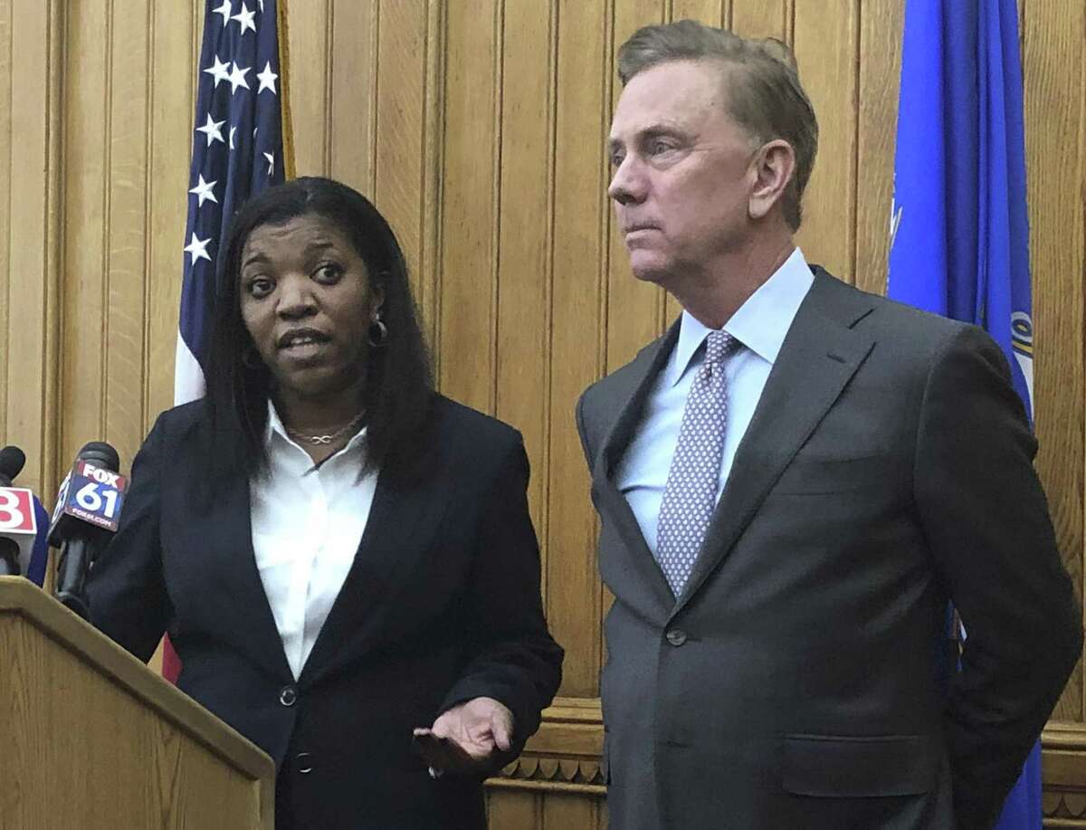 Vannessa Dorantes speaks at the Connecticut State Capitol, Monday, Jan. 7, 2019, in Hartford, following the announcement by Gov.-elect Ned Lamont, right, that she has been nominated to be the next commissioner of the Department of Children and Families.