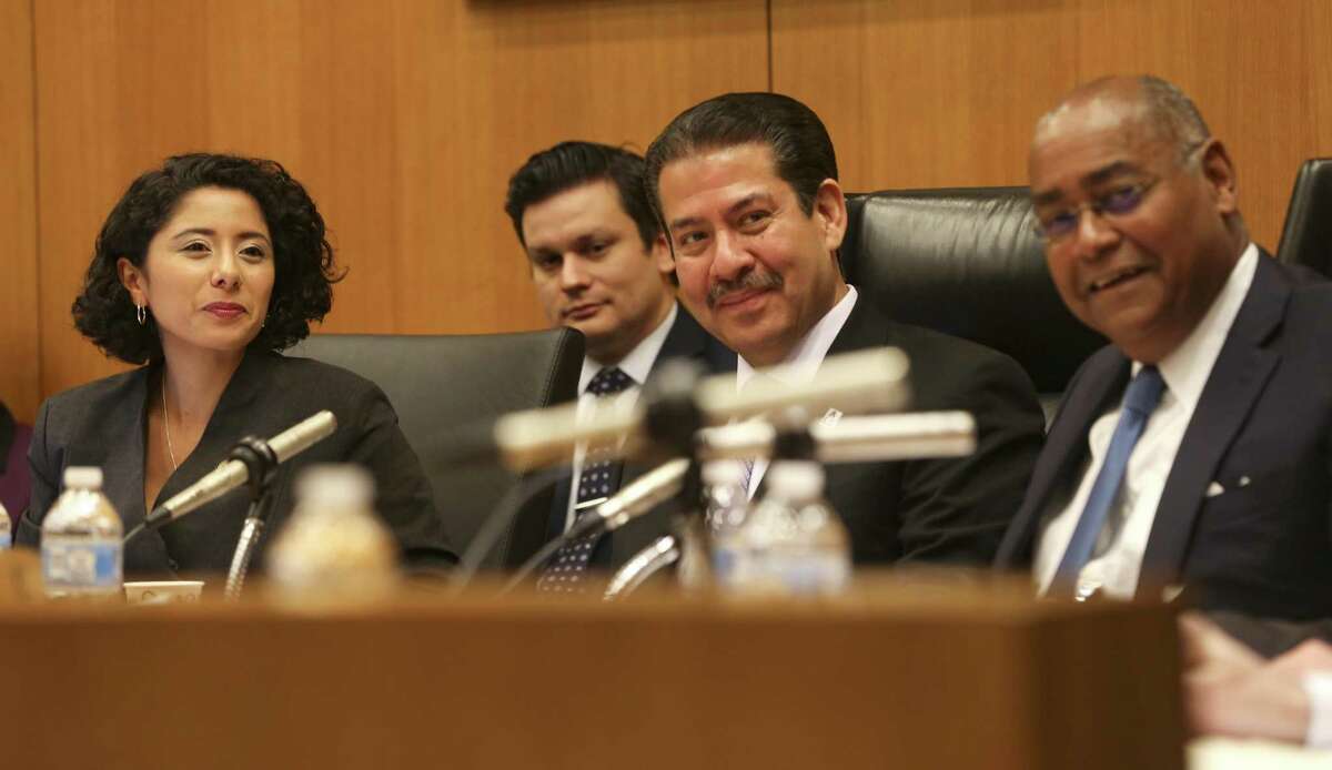 Newly-elected Harris County Judge Lina Hidalgo, left, presides over her first Harris County Commissioners Court with commissioners Adrian Garcia and Rodney Ellis on Tuesday, January 8, 2019 in Houston.