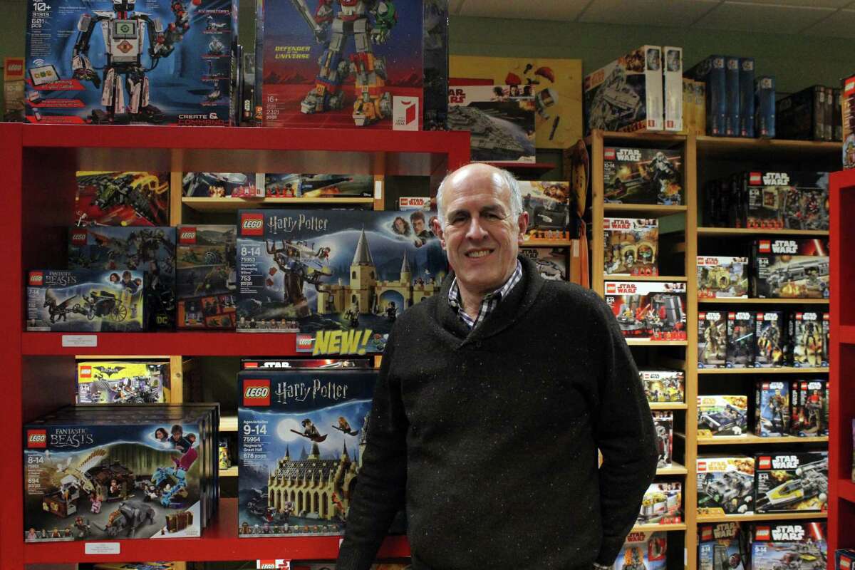 Bill Jensen in front of some of the toys offered at the Darien Toy Box. Taken Jan. 8.