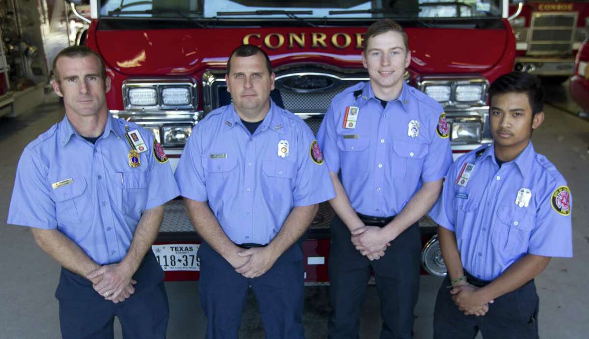 Conroe firefighters Matt Francis, Kevin Murphy, Kain Dodd and Jonathan Merhan pose for a photo, Thur sday, Jan. 9, 2019, in Conroe.The Conroe Fire Department has begun phasing in an additional fourth firefighter per truck as part of the department's effort to increase personnel that began January 1.