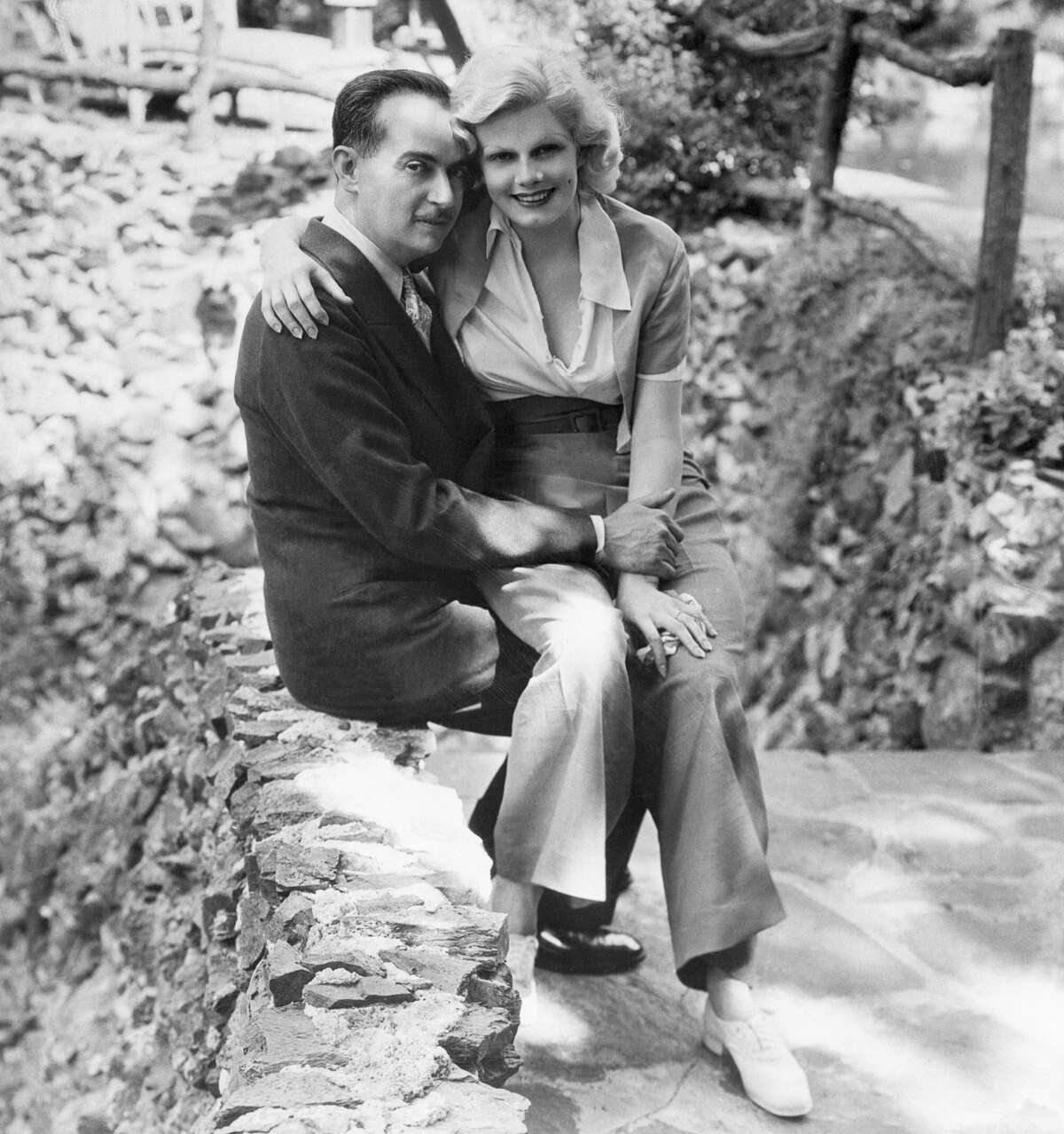 Paul Bern, noted producer, writer and studio executive, whose suicide shocked the country, and his bride, Jean Harlow. This picture was taken shortly after their 1932 marriage.