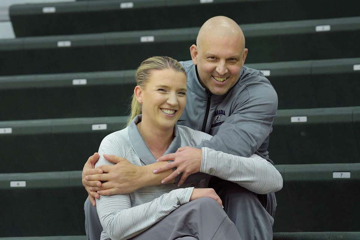 Ali Jaques, foreground, Siena women’s basketball coach, and her fiancé, Marc Rybczyk, Niagara men’s assistant coach, pose for a photo at the Marcelle Athletic Complex at Siena College on Thursday, Jan. 10, 2019, in Loudonville, N.Y. Jaques and Rybczyk got engaged in August. Rybczyk found out this fall he has stage 4 cancer. He’s undergoing treatment and living with Jaques while taking a leave from his coaching job. (Paul Buckowski/Times Union)