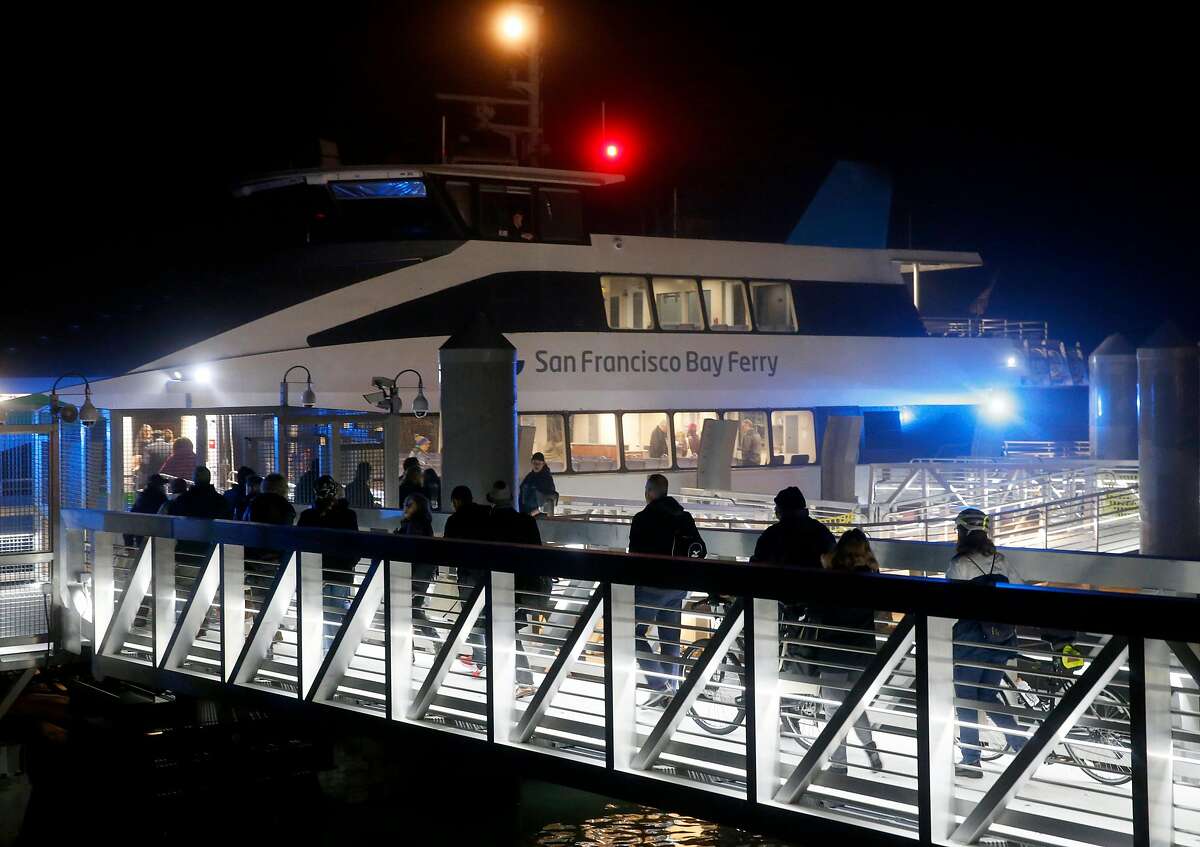 Commuters board the ferryboat Pisces for the inaugural 6:10 a.m. run of ferry service from Richmond to San Francisco in Richmond, Calif. on Thursday, Jan. 10, 2019.