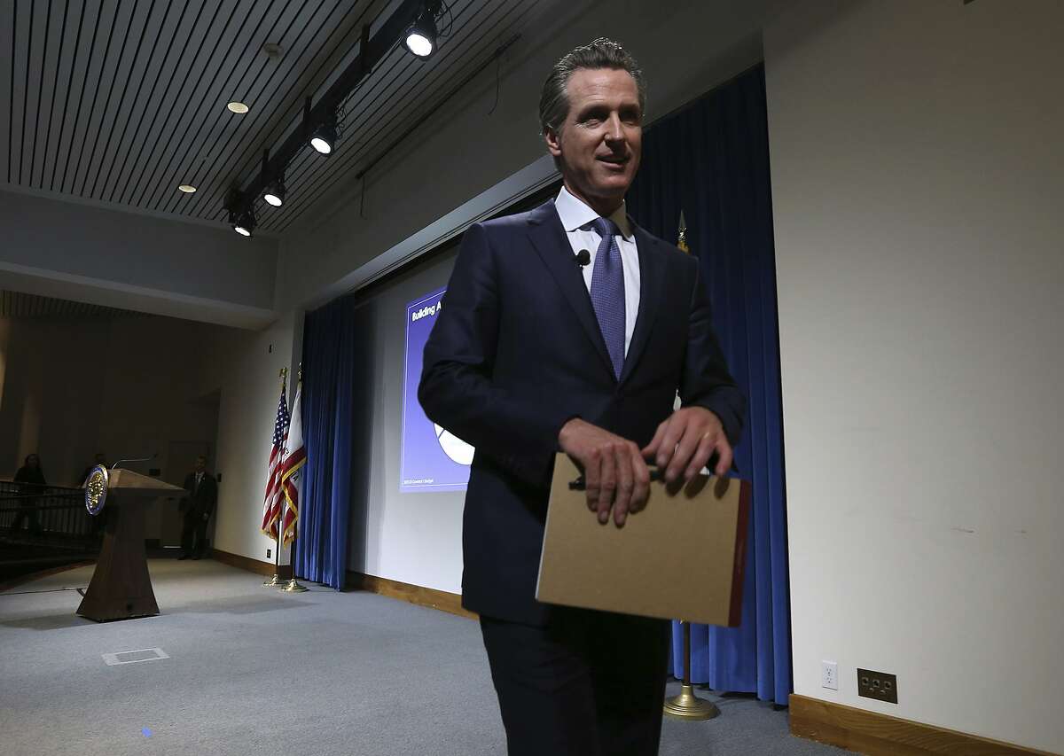 California Gov. Gavin Newsom leaves the auditorium stage after presenting his first state budget during a news conference Thursday, Jan. 10, 2019, in Sacramento, Calif. (AP Photo/Rich Pedroncelli)