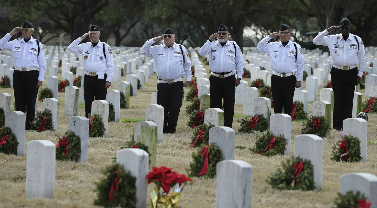 Members of the Fort Sam Houston Memorial Services Detachment salute as family and friends of Maj. James Kelly, a Tuskegee Airman, gather for his funeral service at Fort Sam Houston National Cemetery on Thursday, Jan. 10, 2019. He was born in High Point, North Carolina, served in Korea and brought his family to San Antonio years later. Kelly was laid to rest with military honors including a flyover by a pair of T-1A Jayhawk aircraft by the 99th Flying Training Squadron. Kelly was 90 years old. (Kin Man Hui/San Antonio Express-News)