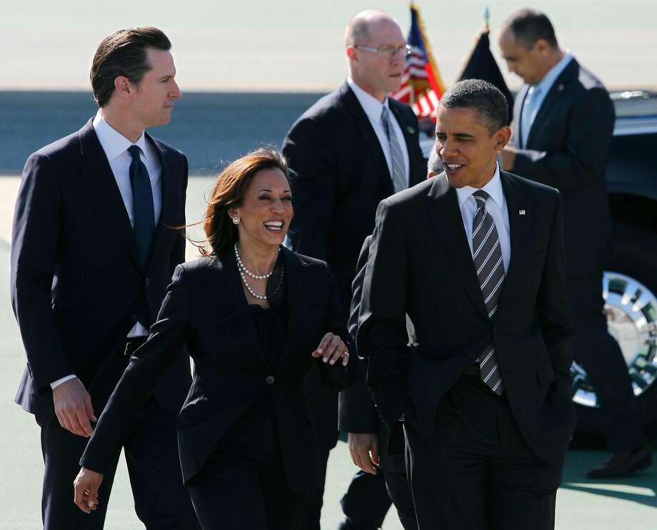 President Barack Obama walks with Attorney General Kamala Harris, Lt. Gov. Gavin Newsom and Mayor Ed Lee (not seen) after his arrival aboard Air Force One at SFO in San Francisco, Calif. on Thursday, Feb. 16, 2012 to attend private fundraising events this evening. Photo: Paul Chinn / The Chronicle 2012