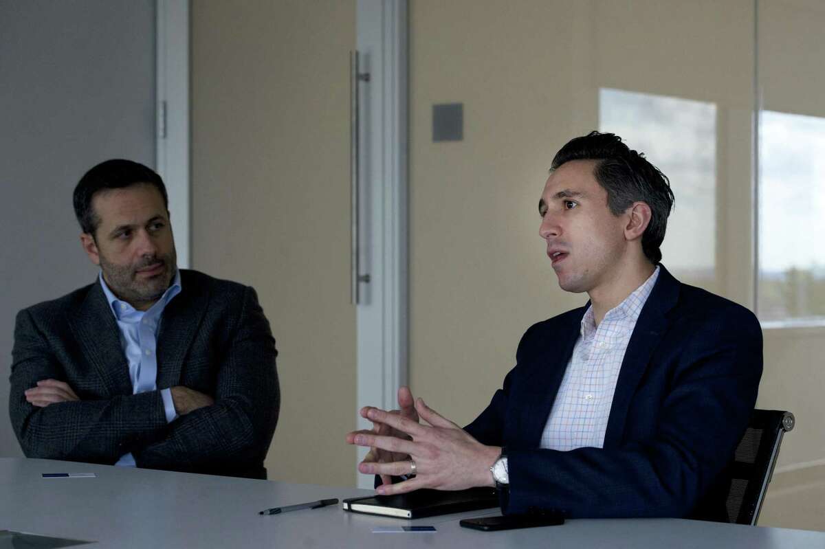 Loxo Oncology Chief Business Officer Jacob Van Naarden, right, and founder and CEO Josh Bilenker discuss the company’s research and development inside the company's headquarters.