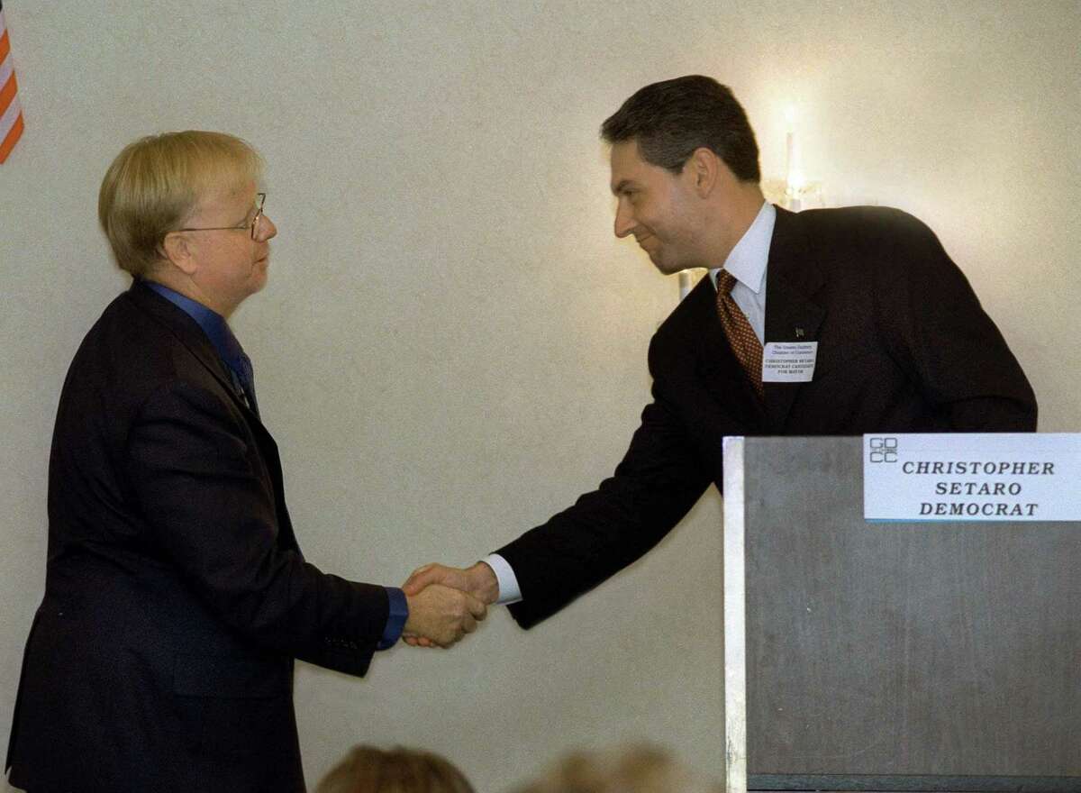 Mark Boughton, left and Chris Setaro, candidates for mayor of Danbury shake hands after a candidates debate sponsored by the Greater Danbury Chamber of Commerce