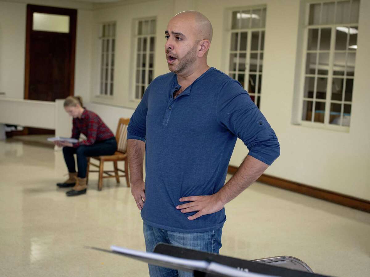Baritone Jose Rubio, center, sings alongside mezzo-soprano Liz Bouk during a rehearsal for Alamo City Opera’s production of “As One.” The chamber opera follows a transgender woman’s journey and tells a universal story, Rubio said: "The story of trying to figure out how to love yourself is really important to tell."