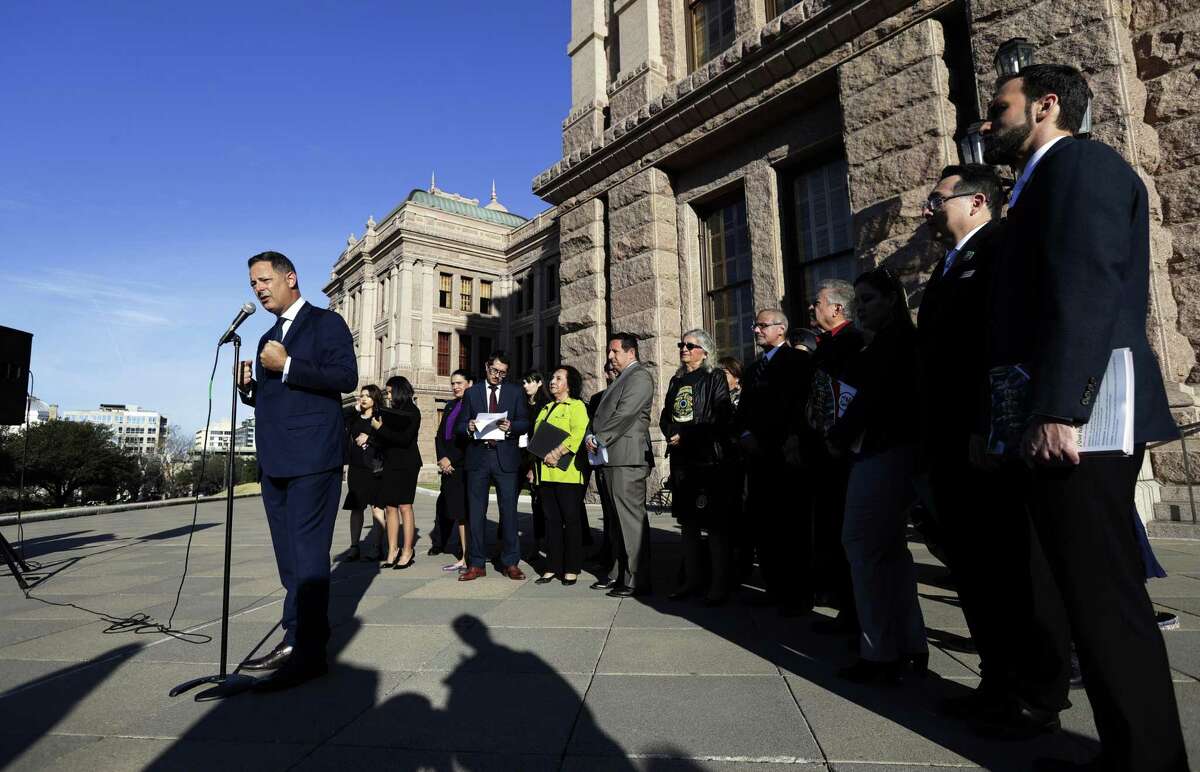 State Rep. Rafael Anchia, D-Dallas, left, takes part in a Texas Latino Education Coalition news conference on the steps of the Texas State Capitol before the opening of the 86th Texas Legislative session, Tuesday. The comptroller forecasts more revenue available for education.