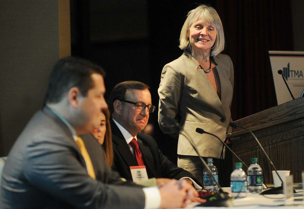 Catherine Smith, leads an economic panel discussion in November 2015 at Fairfield University, in her role as commissioner of the Connecticut Department of Economic and Community Development.