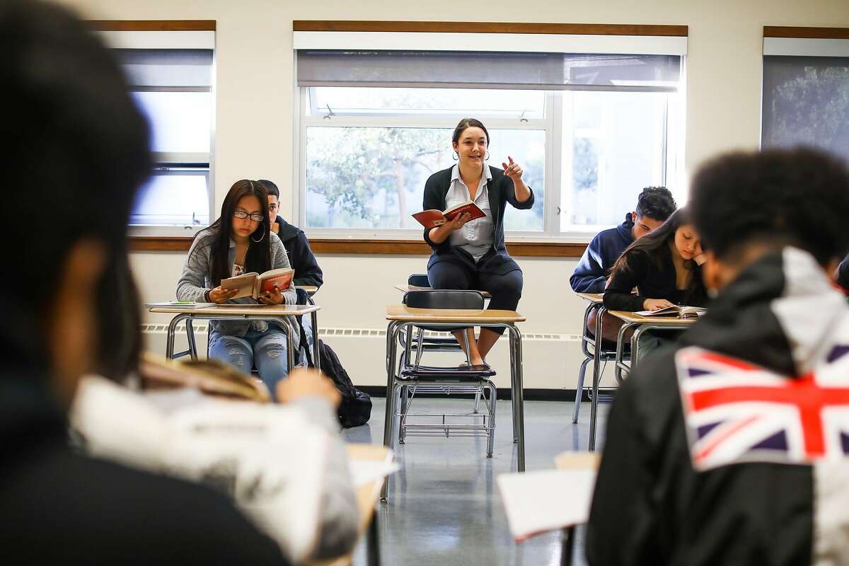 European literature teacher Liz Kaufman (center) calls on a student to read out loud as they read Persepolis at Phillip and Sala Burton High School in San Francisco, California, on Monday, Sept. 10, 2018.