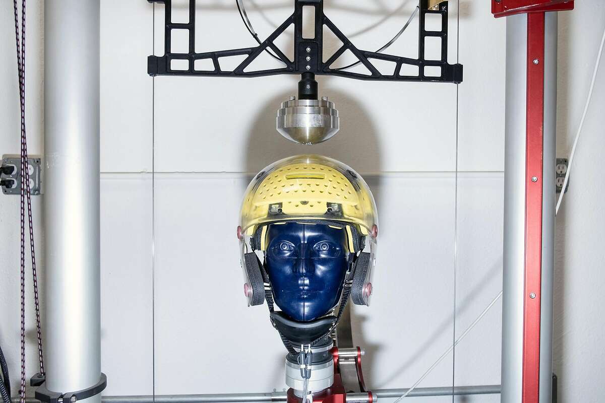 A prototype football helmet is strapped to a test dummy's head on an impact testing drop rig at Brainguard Technologies Inc. facilities in Richmond, California, on Thursday, December 13, 2018. A group of UC Berkeley faculty and alums has launched the start-up Brainguard Technologies Inc. addressing the key issue in CTE: rotational force, and are developing helmets for all major sports that tackle the issue.