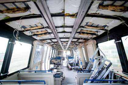Rubble lines the interior of BART car 2528, slated to be the first decommissioned as new trains enter the transit system's fleet, at BART's Hayward, Calif., maintenance yard on Wednesday, Jan. 9, 2019.