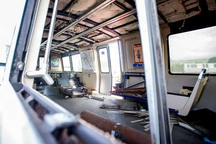 Rubble lines the interior of BART car 2528, slated to be the first decommissioned as new trains enter the transit system's fleet, at BART's Hayward, Calif., maintenance yard on Wednesday, Jan. 9, 2019.