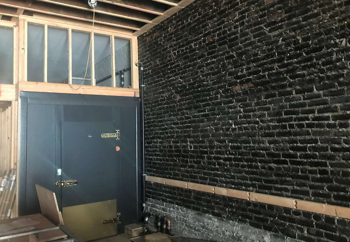 The brick wall in Sam's Tavern as it looked in July of 2018, after being cleaned but before construction of the tavern began in earnest. The black on the masonry is soot left behind from the 1906 earthquake and fire, according to the bar's owners.
