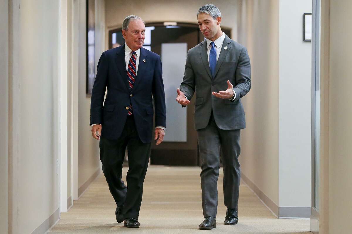 Michael Bloomberg, left, former New York City mayor and U.N. special envoy for climate action, (left) walks with San Antonio Mayor Ron Nirenberg prior to a news conference where Bloomberg announced up to $2.5 million to support San Antonio’s climate action initiatives on Jan. 11, 2019.