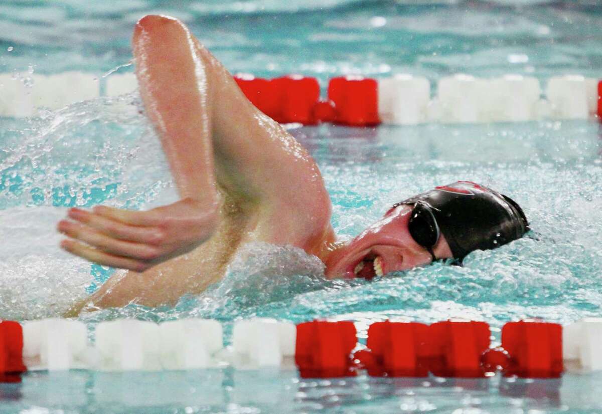 New Canaan's Jake Ritz competes in the 500 yard freestyle during swim action against Greenwich in Greenwich, Conn., on Friday Jan. 11, 2019.