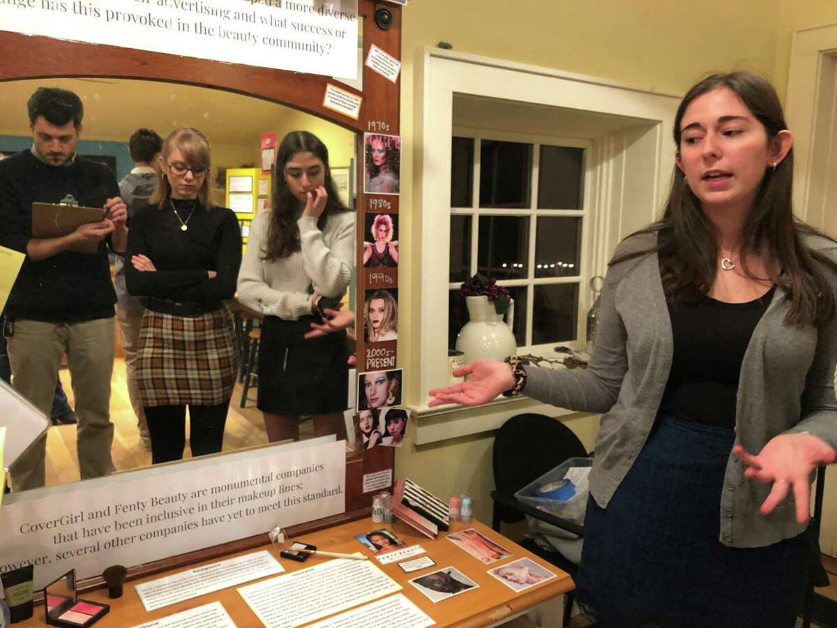 Greenwich High School senior Jessica Neri presents her findings from a research project into the history of the makeup industry and recent efforts by a handful of companies to tailor their products to people of color, men and older women.