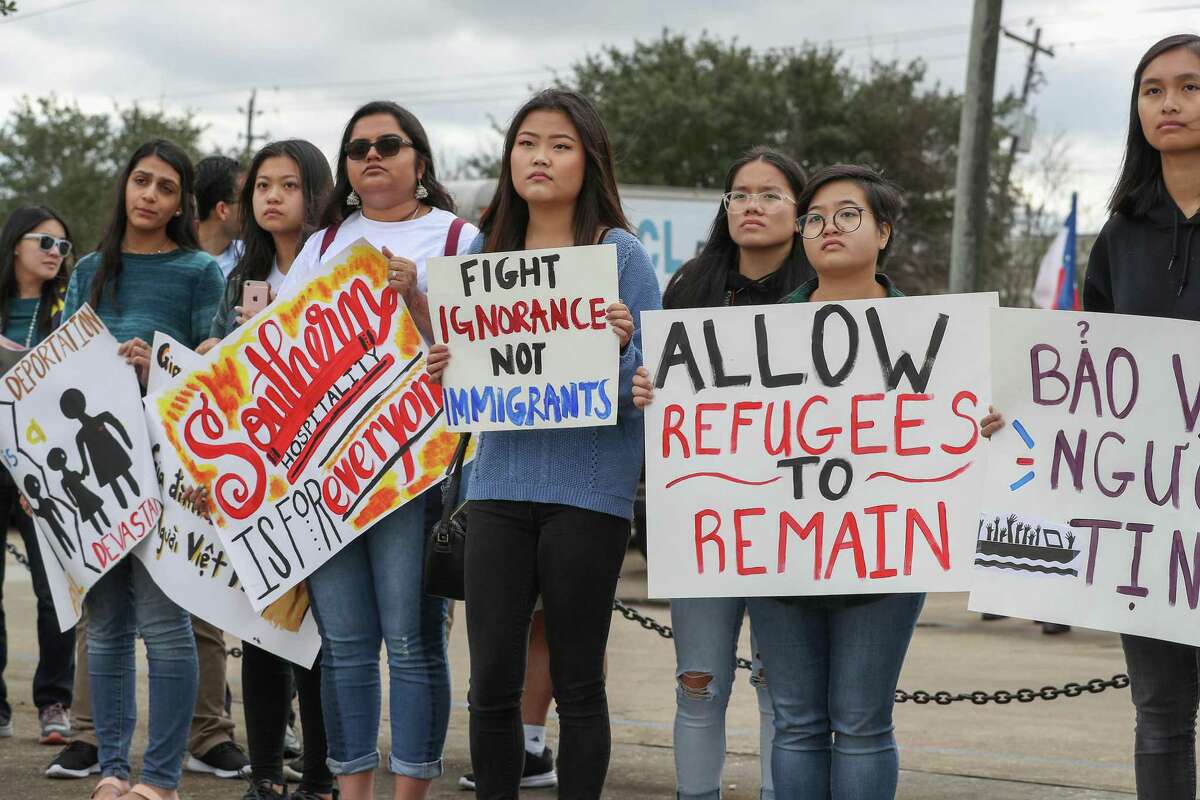Concerned participates hold signs during a rally held by HAAPI Youth and community partners at the Vietnam Memorial Saturday, Jan. 12, 2019, in Houston. The rally was held in light of the United States Administration's heightened attacks to deport impacted Vietnamese and Southeast Asian communities and renegotiating the 2008 United States - Vietnam Repatriation Agreement?.