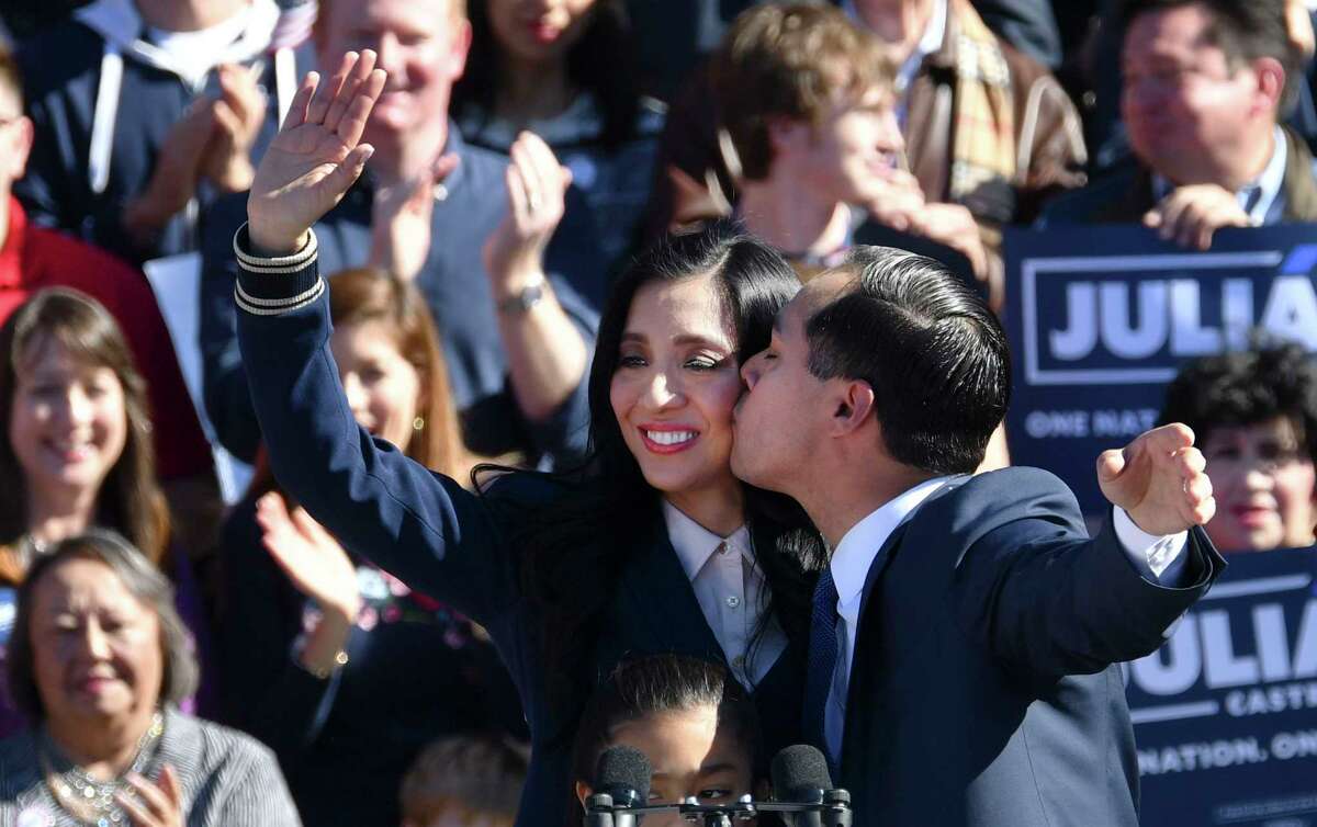 Julian Castro kisses his wife, Erica, after his announcement that he is running for president of the United States in 2020 during a rally at Plaza Guadalupe on Saturday, Jan. 12, 2019. His mother, Rosie Castro, is at lower left.