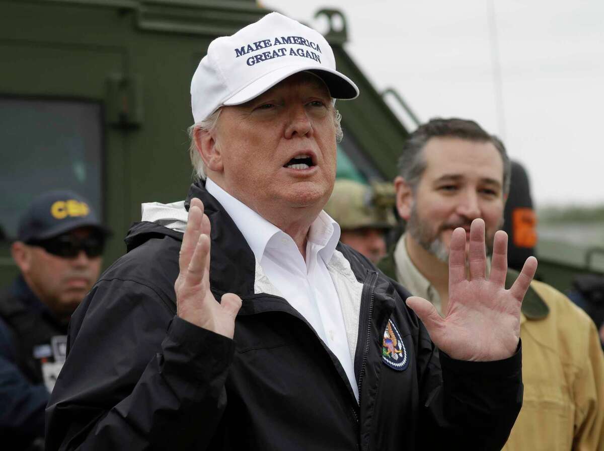 President Donald Trump speaks as he tours the U.S. border with Mexico at the Rio Grande on the southern border, Thursday, Jan. 10, 2019, in McAllen, Texas, as Sen. Ted Cruz, R-Texas, listens at right. (AP Photo/ Evan Vucci)