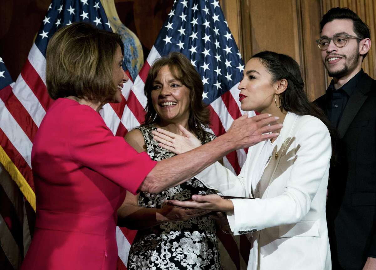 Rep. Alexandria Ocasio-Cortez (D-N.Y.) during a ceremonial swearing-in to the 116th Congress, with House Speaker Nancy Pelosi, on Capitol Hill in Washington, Jan. 3, 2019.