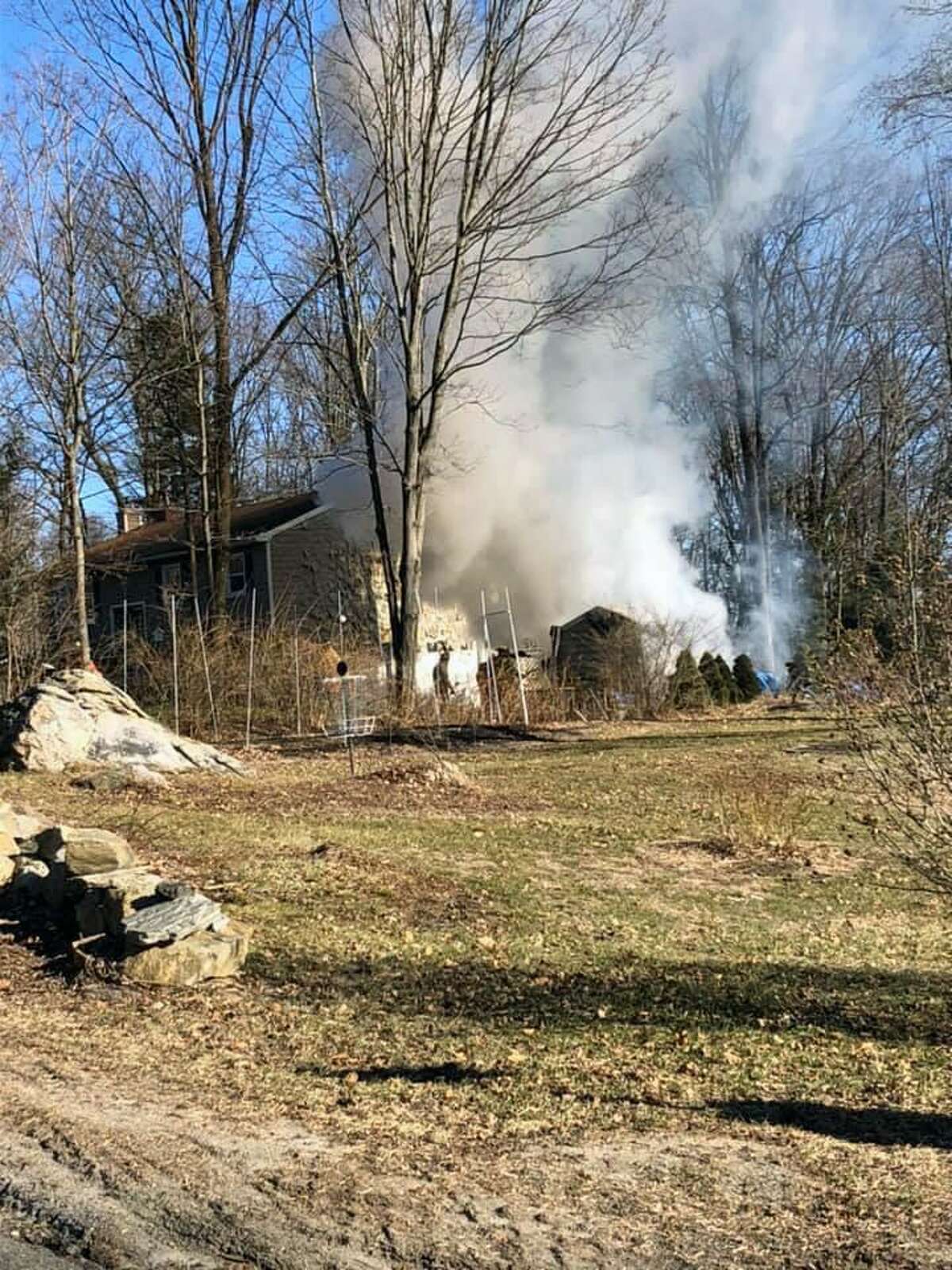 Firefighters extinguished a boat and shed fire in New Milford, Conn., on Jan. 11, 2019.