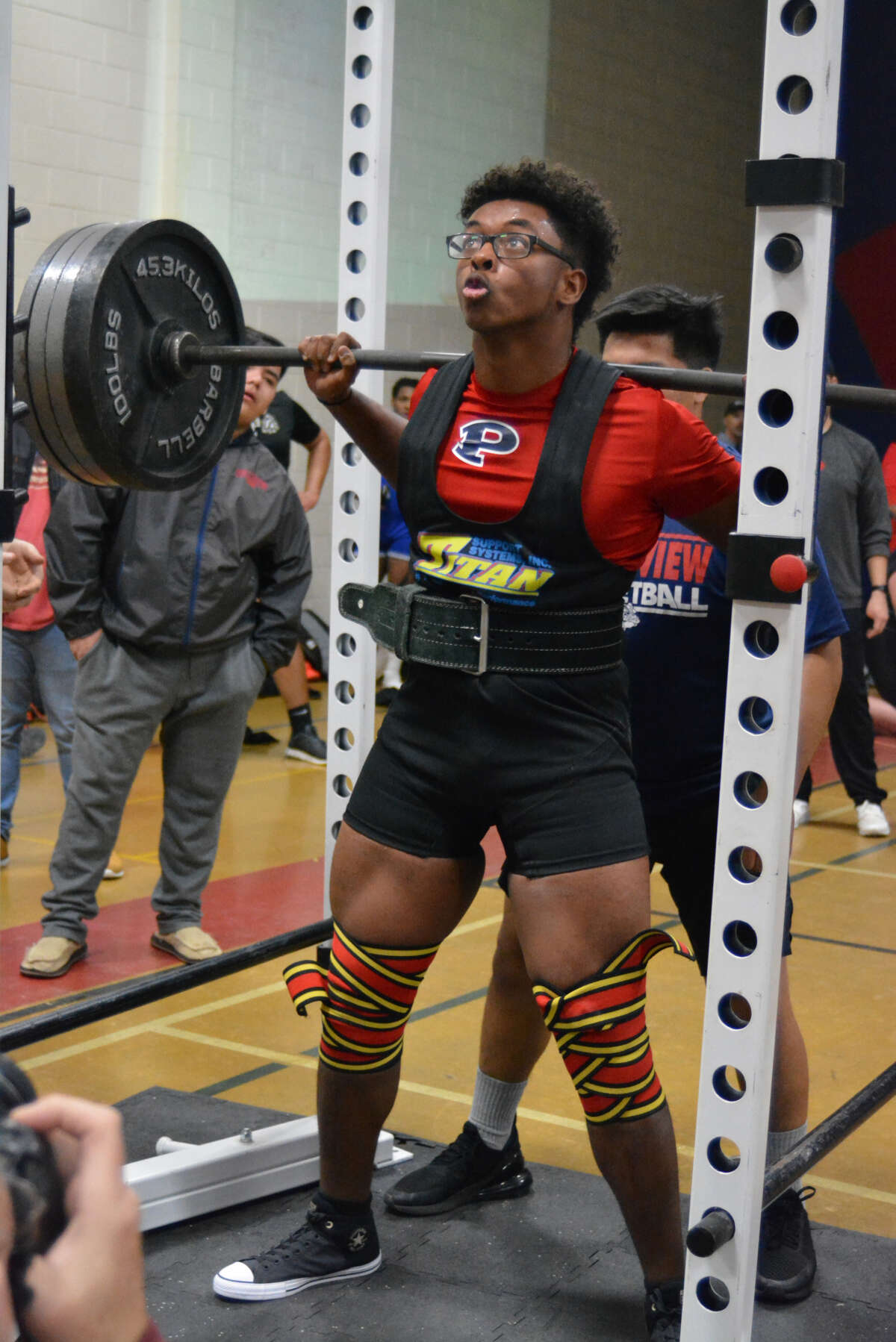 Plainview Bulldog D’Shae Casias prepares to complete his squat during the Plainview Invitational on Saturday at Coronado Middle School in Plainview. Casias placed first at 220.