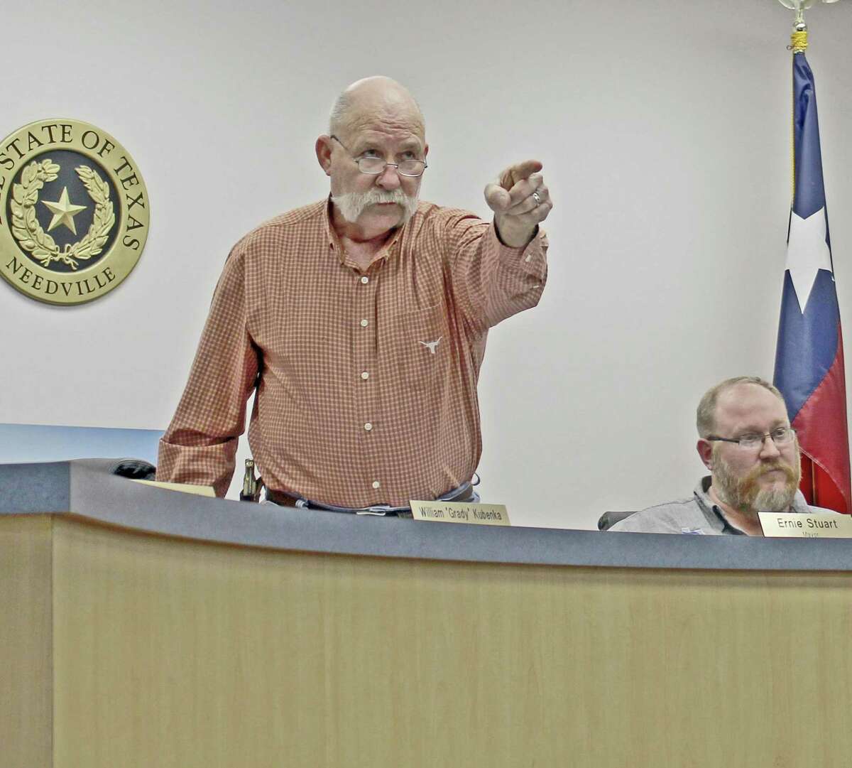 Tempers flared at a recent Needville City Council meeting during discussions over a lawsuit recently filed against the city temporarily blocking plans to demolish the city’s historic water tower. Mayor Stuart stood and yelled for police officers to escort a woman from the meeting after she spoke out from the audience. “You people think I am playing up here?” Stuart said, shaking his finger at the standing-room only crowd. A trial is scheduled Oct. 9 to decide the fate of the water tower.