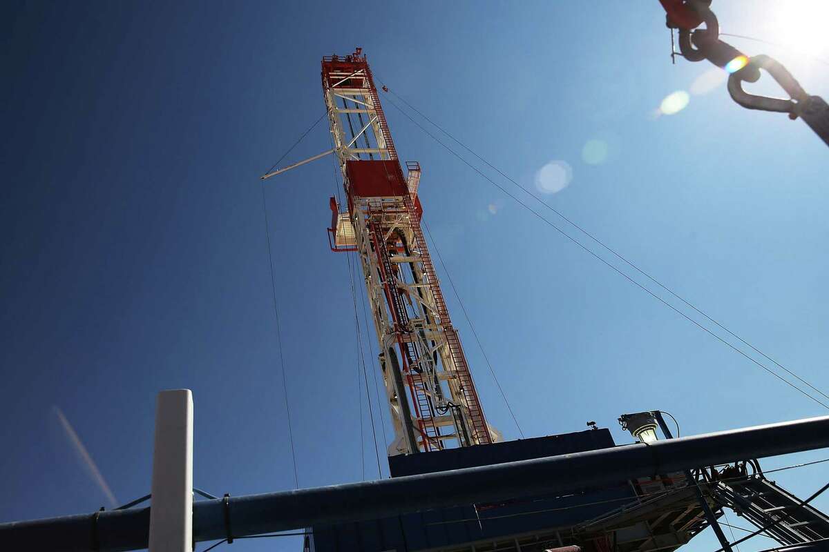 The Patterson 298 natural gas fueled drilling rig drills on land in the Permian Basin. Even though crude prices have dropped drastically from their peak in 2018, a repeat of the last oil and gas industry downturn is unlikely this year, according to a survey by the Federal Reserve Bank of Dallas.
