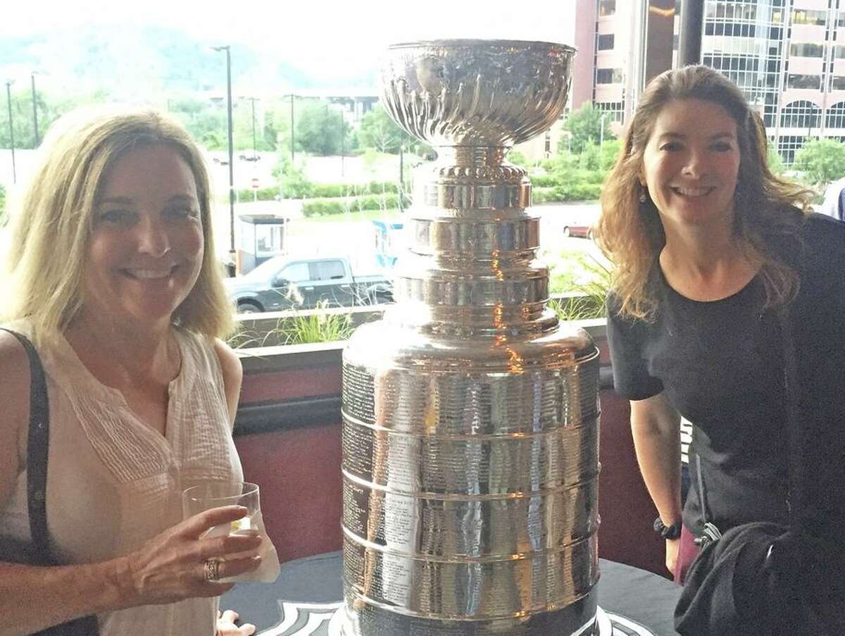 Chronicle columnist Ann Killion (left) and staff writer Susan Slusser with the Stanley Cup in Pittsburgh in 2016.