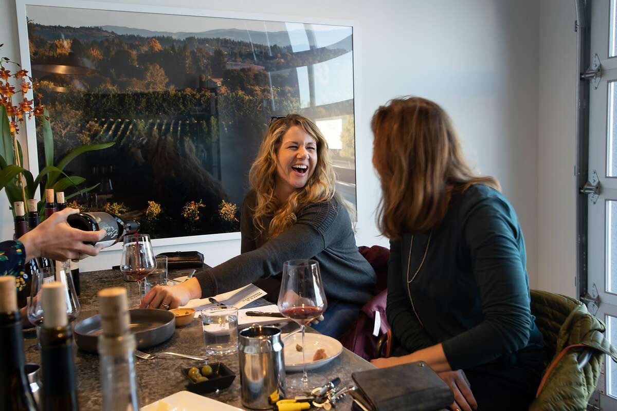 Alethea Behrens and Heather Wilson enjoy a private wine tasting at Grand Cru Custom Crush on Saturday, Jan. 12, 2019, in Healdsburg, Calif.