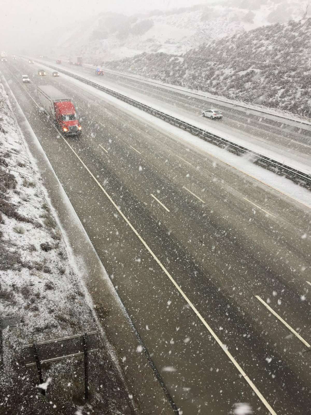FILE — Snow on Interstate 5 over the Grapevine on Jan. 14, 2019. Forecasters warn the Grapevine and I-80 heading to Tahoe could have nasty winter weather conditions Thanksgiving week.