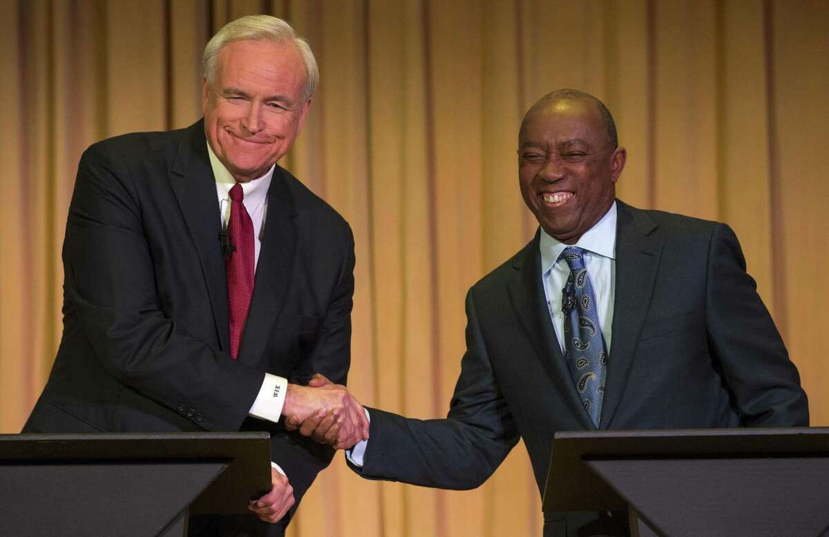 Bill King, left, is shown during a December 2015 mayoral debate with Sylvester Turner.