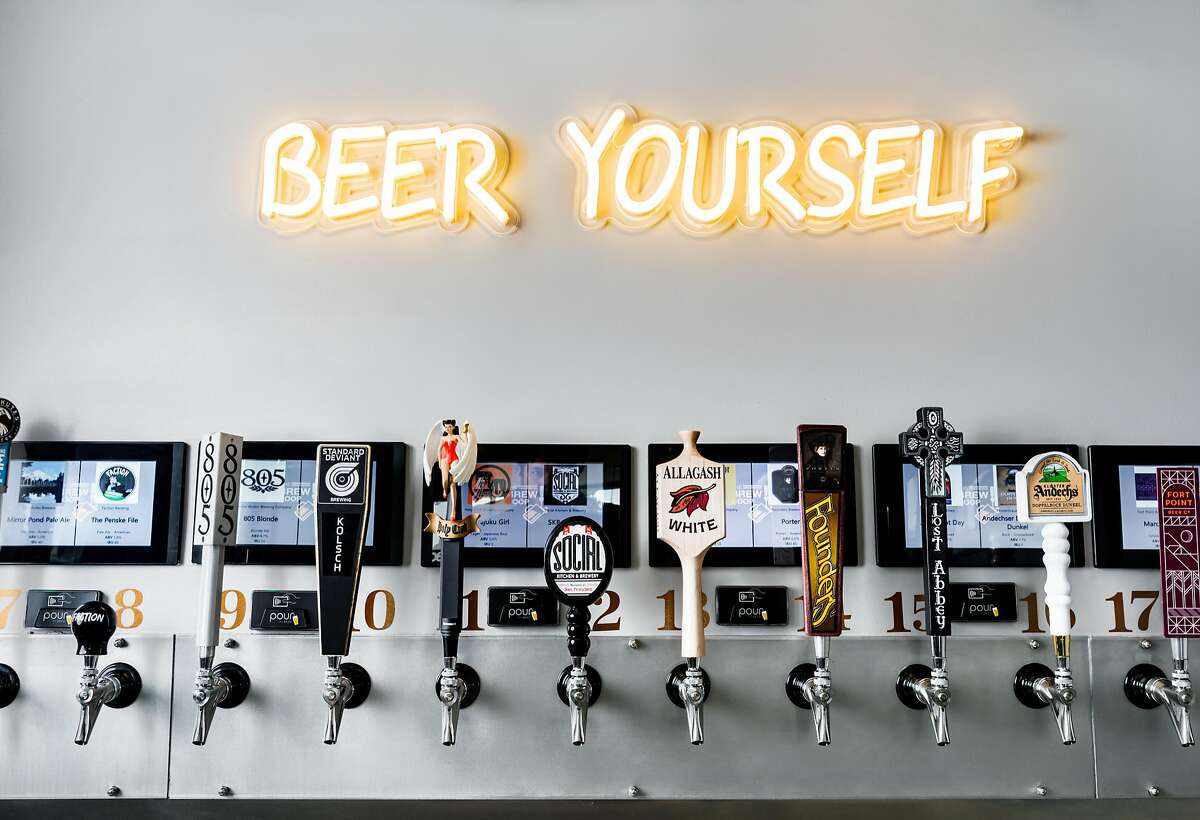 Some of the "pour-it-yourself" taps inside the Brew Coop on Valencia Street.