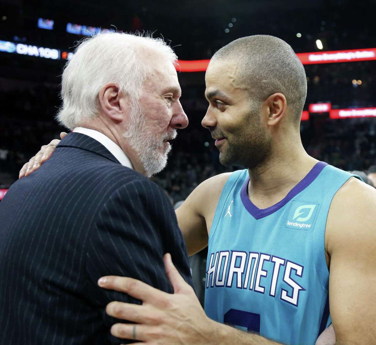 Tony Parker greets Spurs head coach Greg Popovich at the end of the game on Monday, January 14, 2019 at AT&T Center.