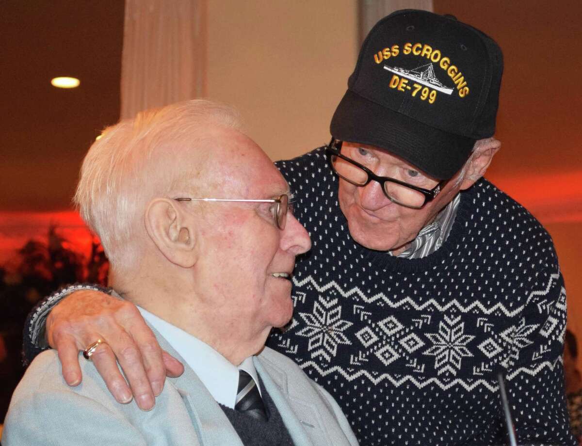 Longtime Water Witch members Art Carlson, left, and Paul Hulton greet each other and share a few stories before dinner.