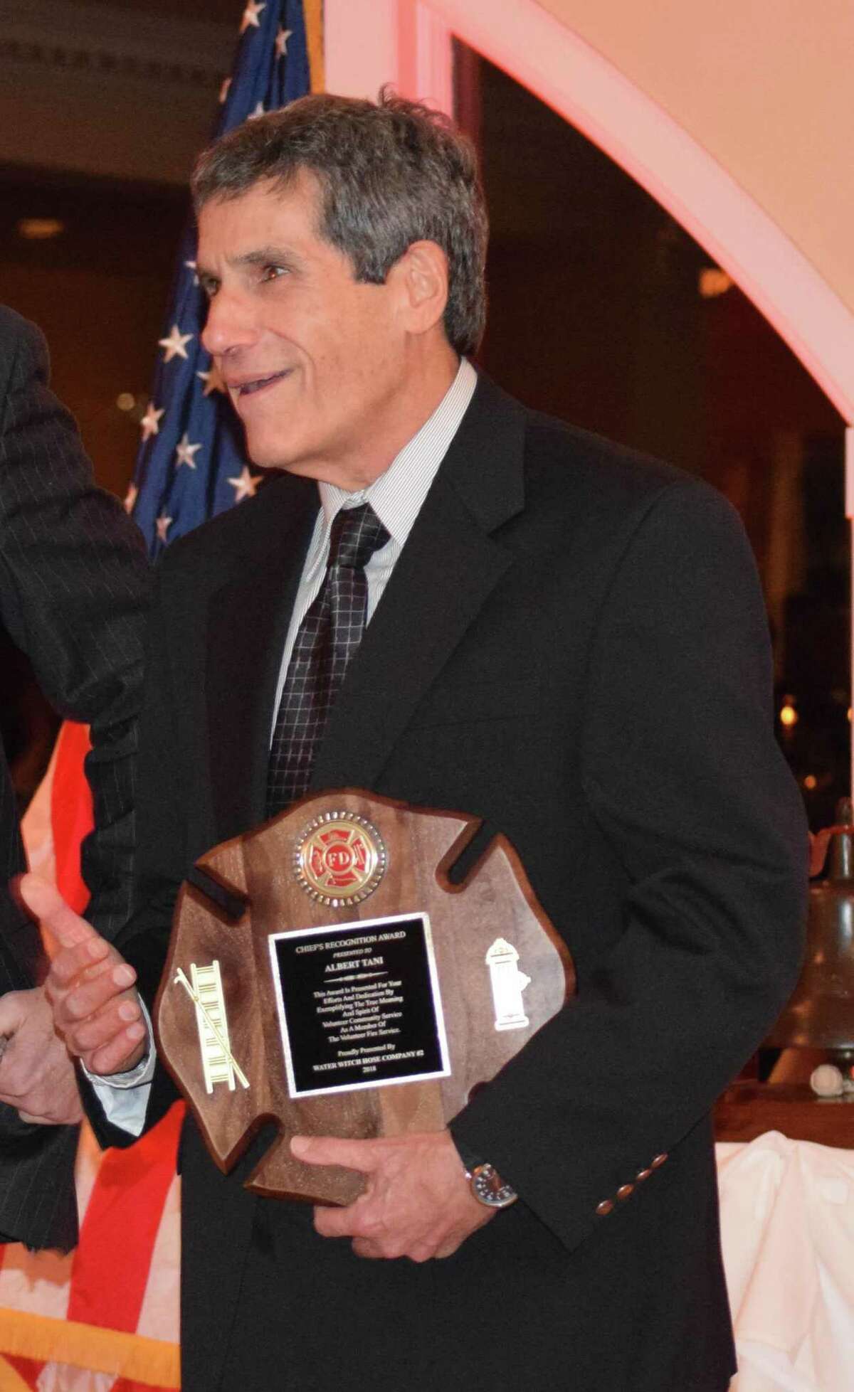 Spectrum/Water Witch Hose Co. #2 in New Milford held its annual dinner Jan. 11, 2019, at Candlewood Inn in Brookfield. The event included a cocktail hour, the presentation of the chief?'s report, the captain?'s report, milestone anniversary pins and the Chief?'s Award, dinner and dancing. Member Al Tani accepts the Chief's Award as guests give him a standing ovation.