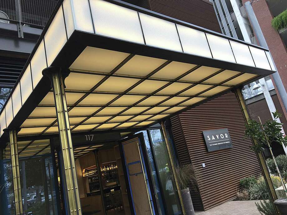 The lightbox over the front entrance of Savor, the new restaurant at The Culinary Institute of America, San Antonio, at the Pearl was the work of Robert Diaz de Leon. Photo: Mike Sutter /Staff