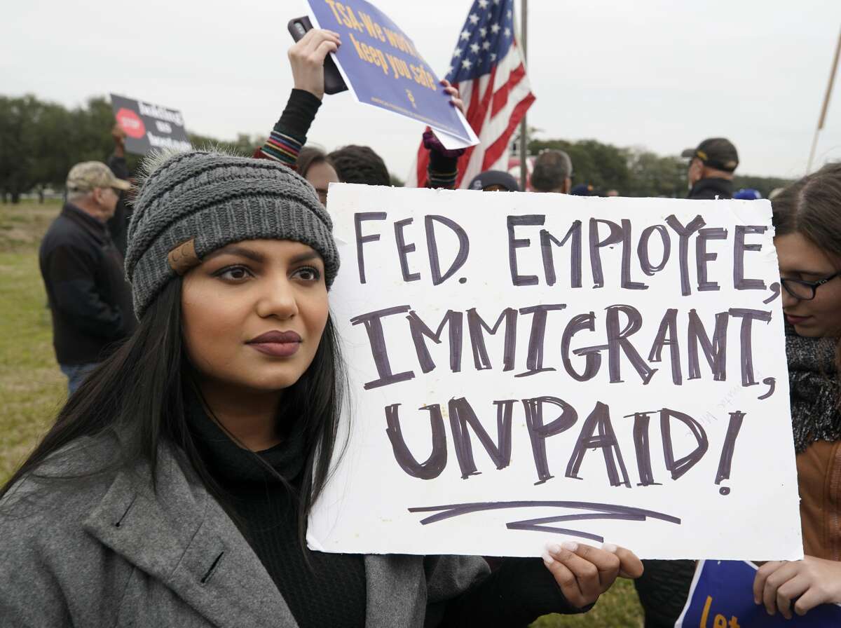 Paromita Mitra, a NASA engineer, protests with others outside of NASA's Johnson Space Center against the government shutdown Tuesday, Jan. 15, 2019, in Houston.